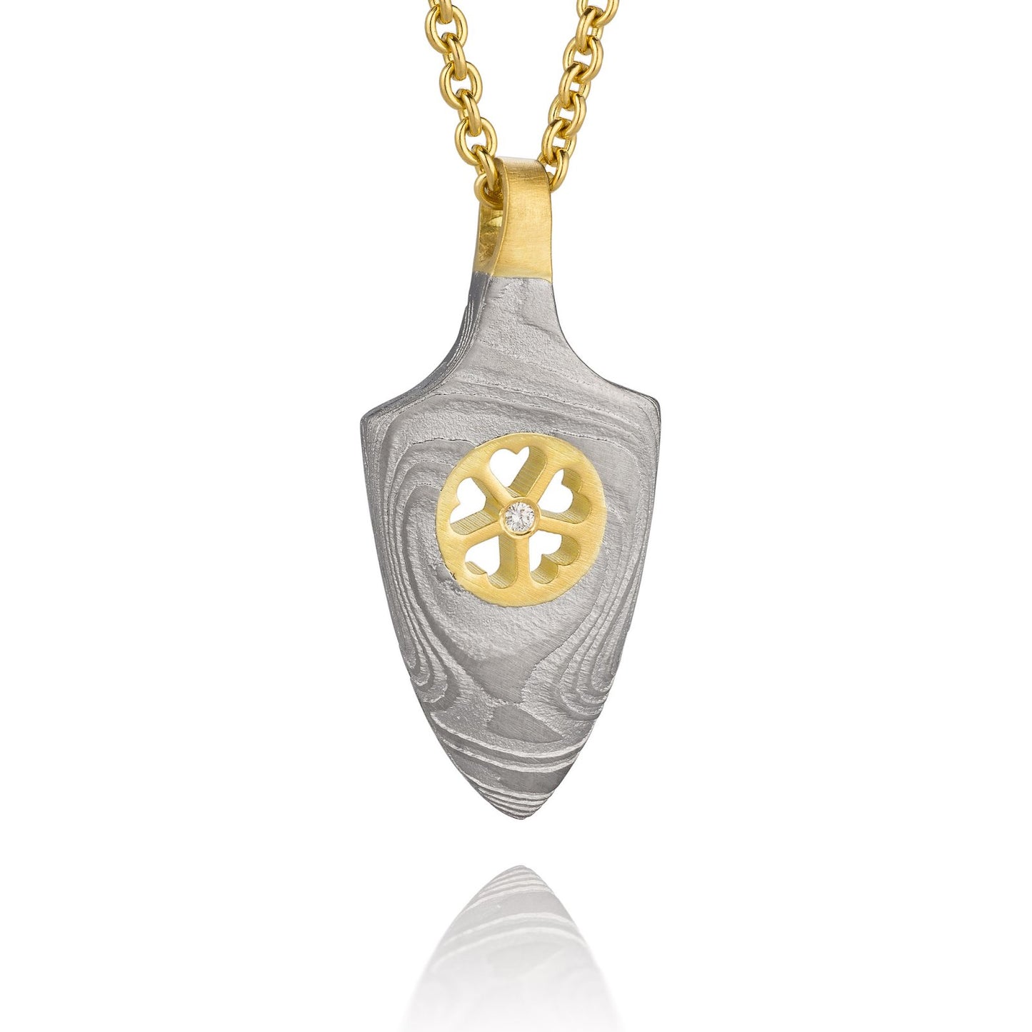 Gold shield-shaped Damascus necklace on a white background.