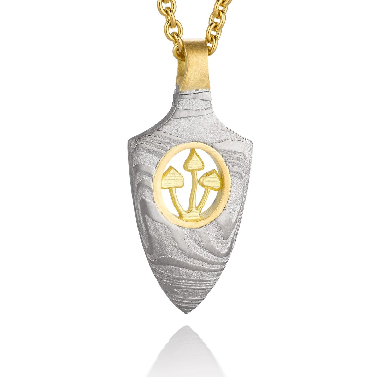 Gold shield-shaped Damascus necklace on a white background.