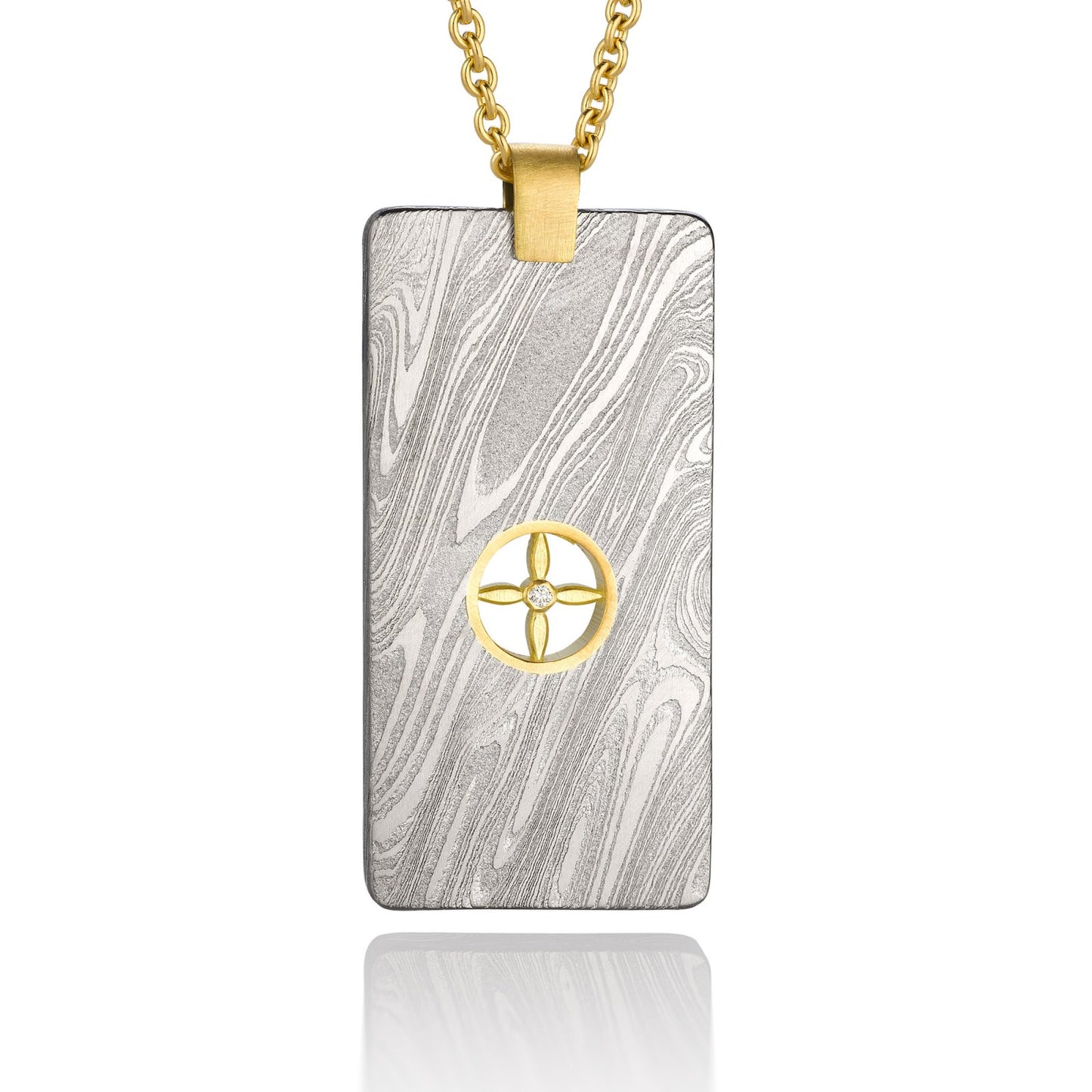 Gold shield-shaped Damascus necklace on a white background.