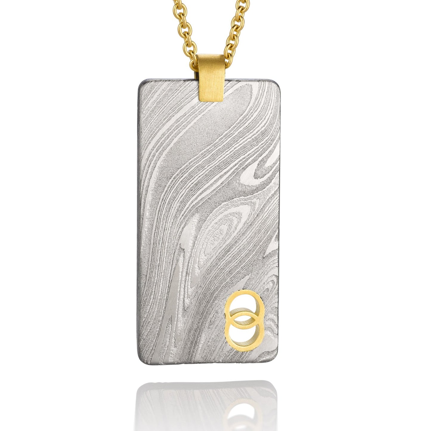 Silver shield-shaped Damascus necklace on a white background.