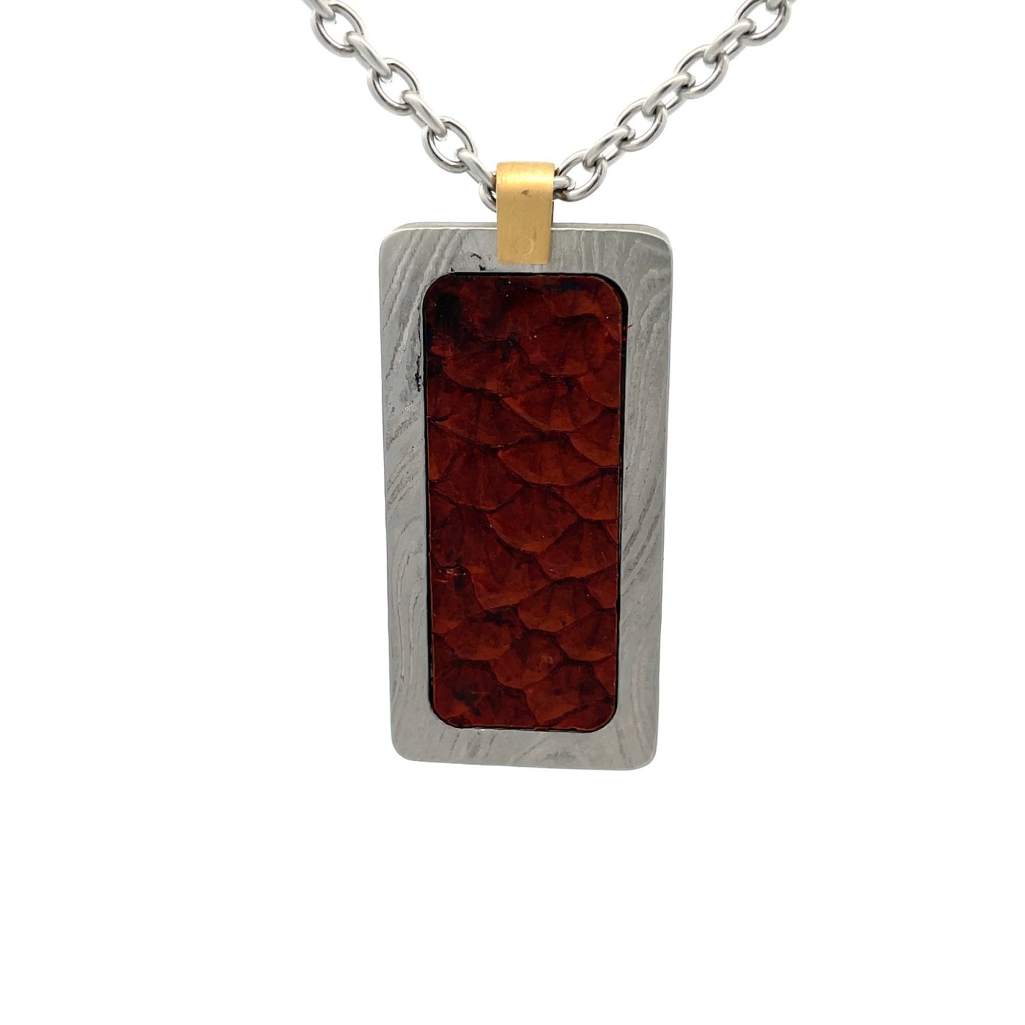 Silver rectangular pendant with a red center piece and a gold top, on a white background.