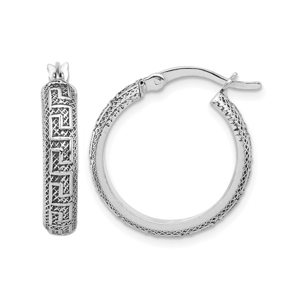 Silver hoop earrings with a Greek key design. The background is white.
