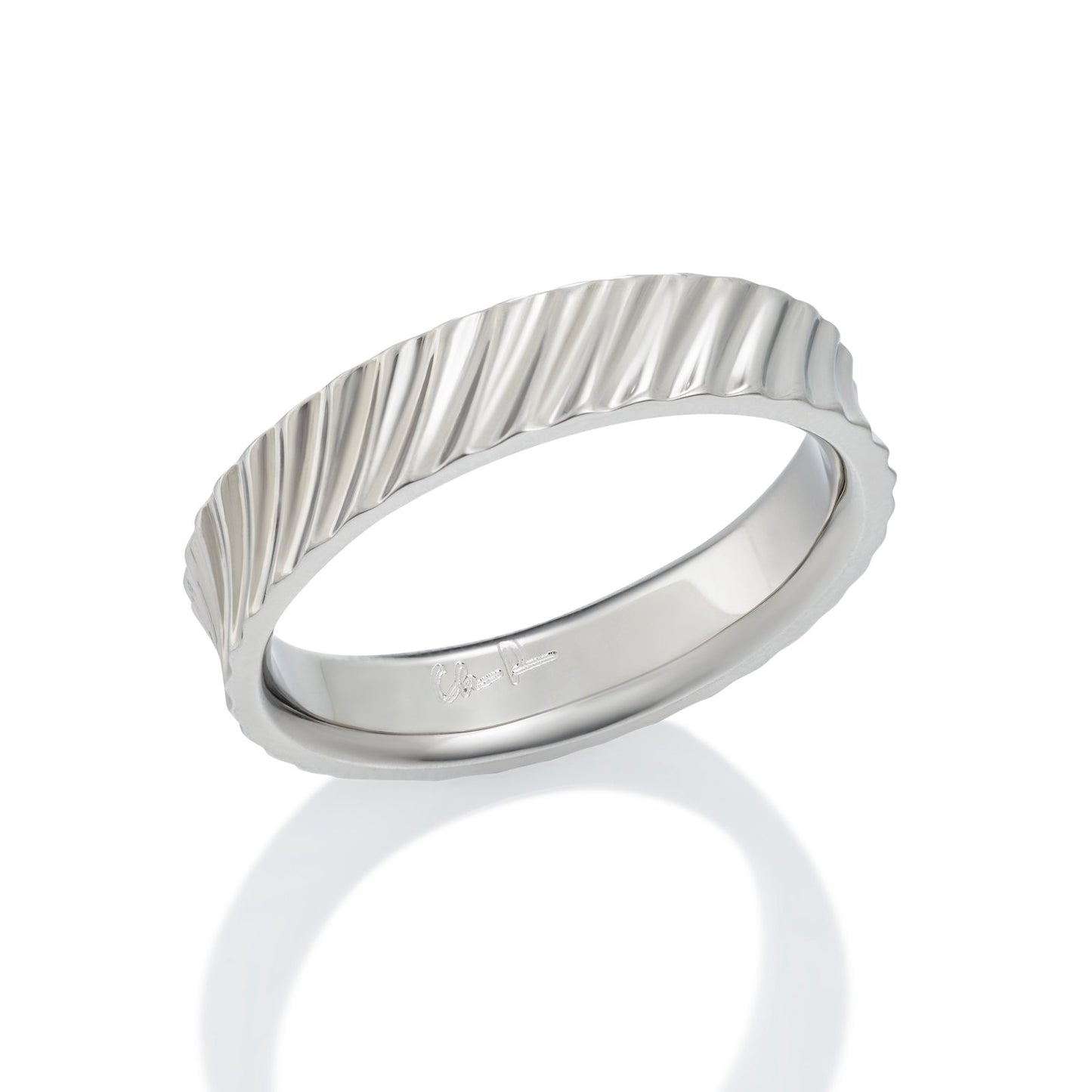 Silver ring with a textured, wavy pattern on a white background.