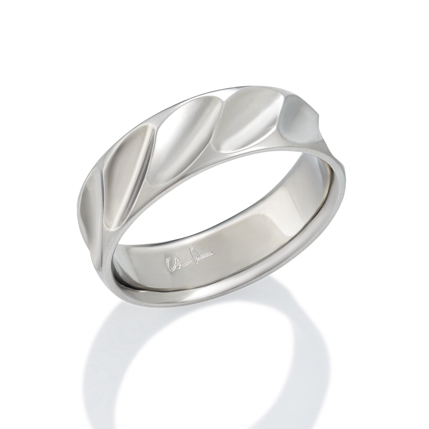 Silver ring with a textured, organic, wave-like design on a white background.