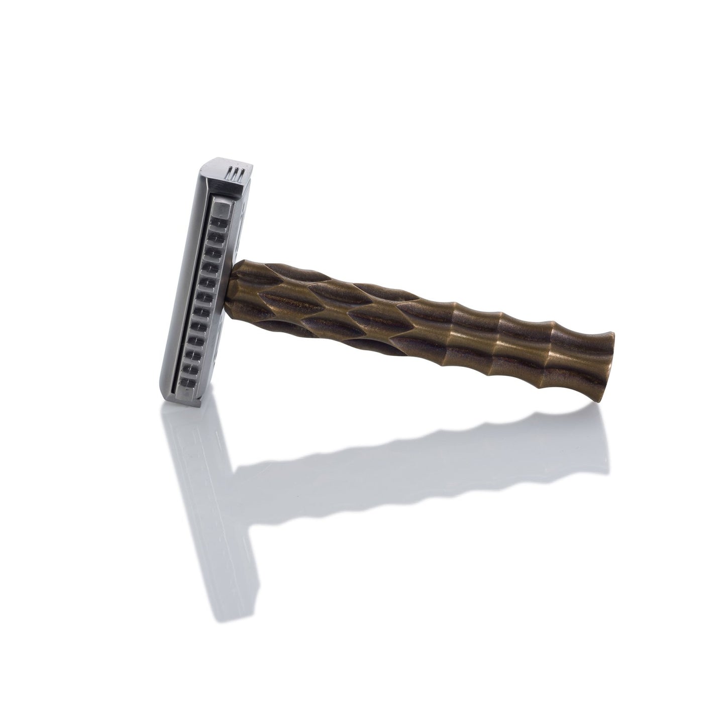 Razor with a textured brown handle and a silver-colored blade head, on a white background