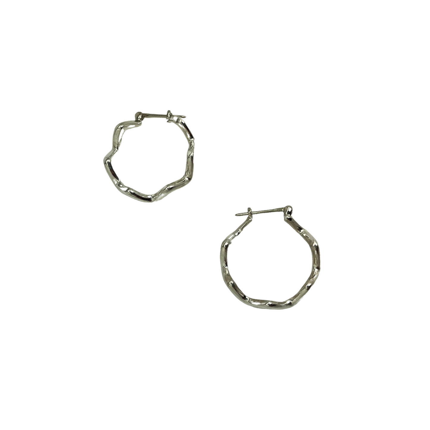 Pair of silver hoop earrings on a white background