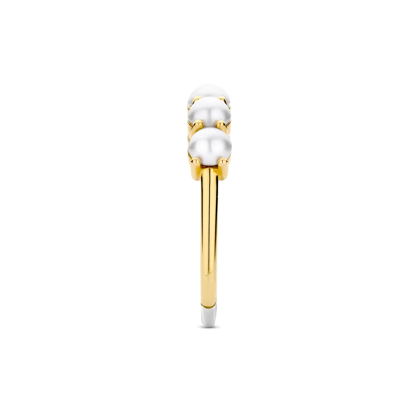 Gold ring with three pearls on a white background