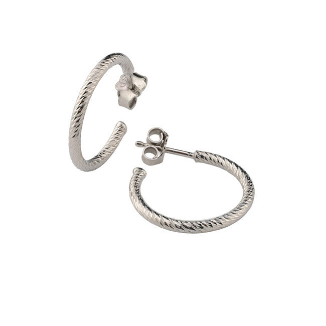 Pair of silver hoop earrings on a white background