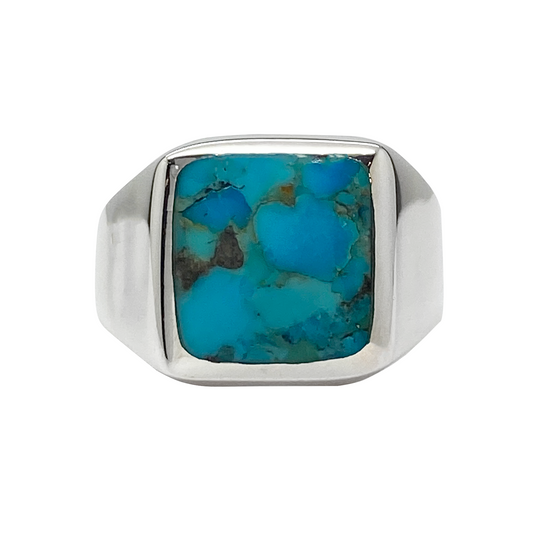 Silver ring with a turquoise stone on a white background