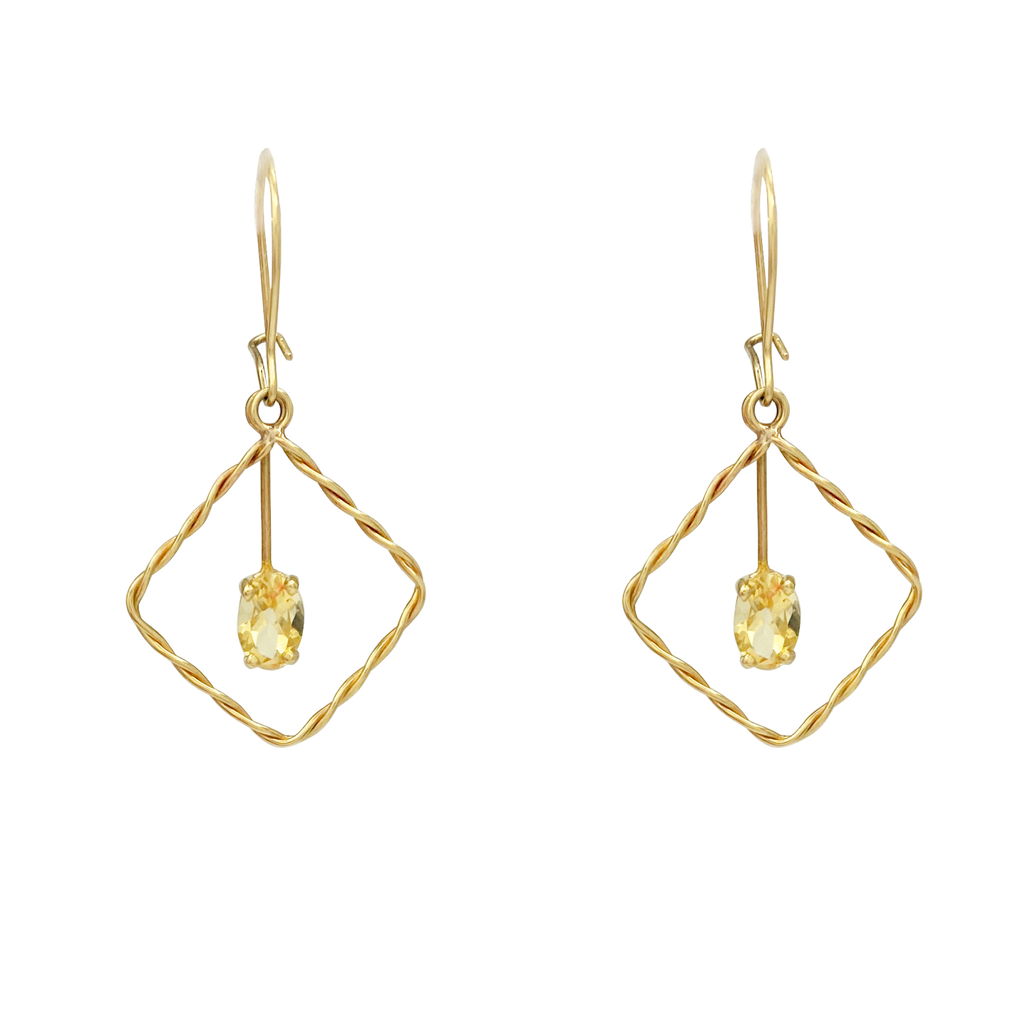 Pair of yellow gold dangle earrings with twisted square frames, each suspending an oval yellow gemstone.