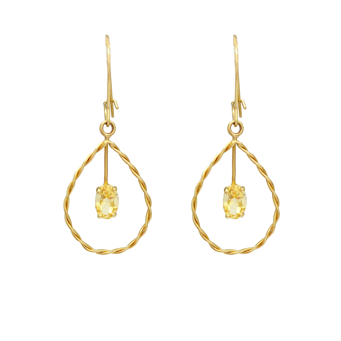 Pair of yellow gold dangle earrings with twisted square frames, each suspending an oval yellow gemstone.