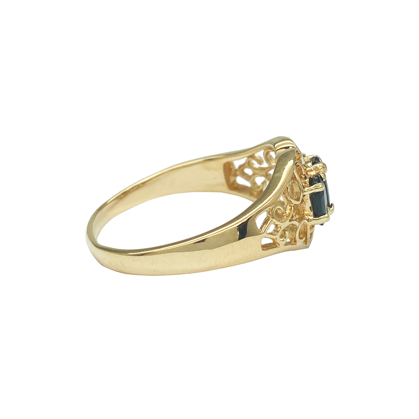 Yellow gold three-stone sapphire ring with filigree.