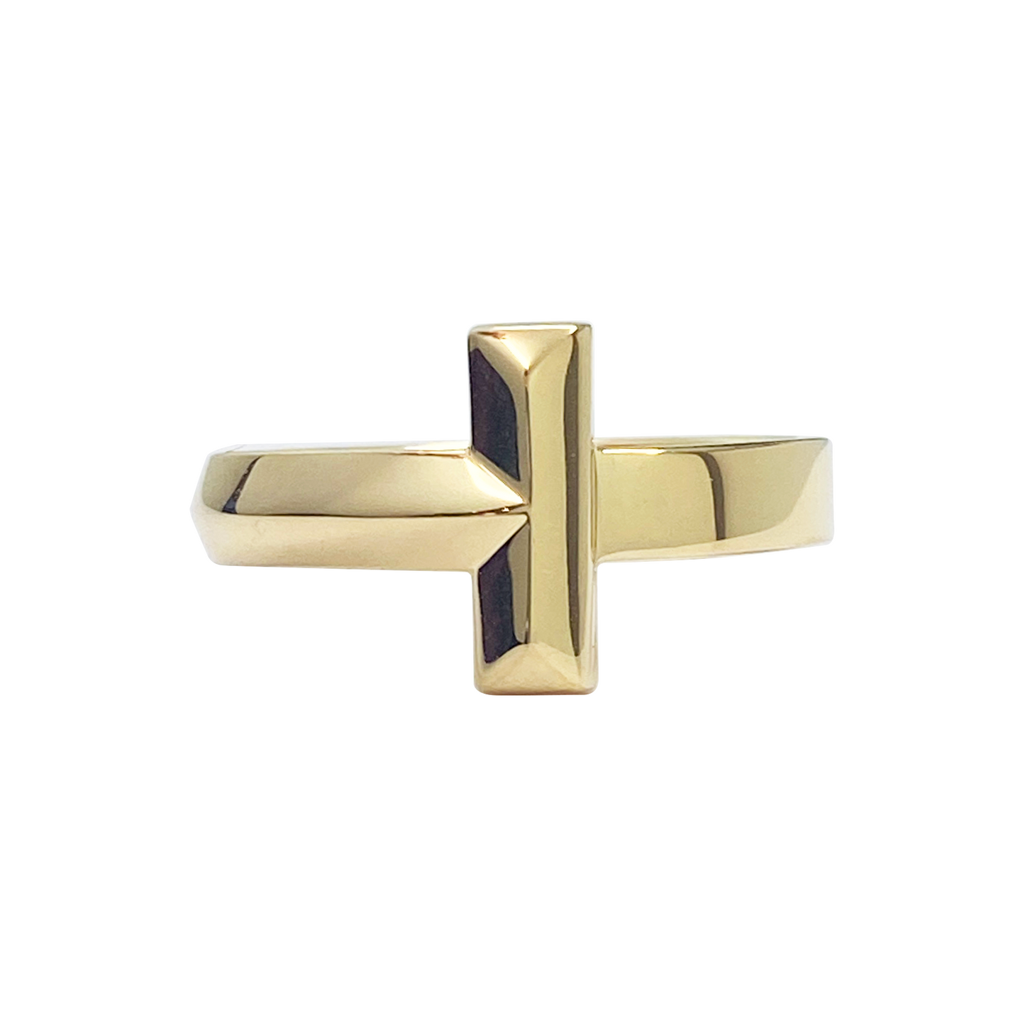 Gold ring with a black center on a white background