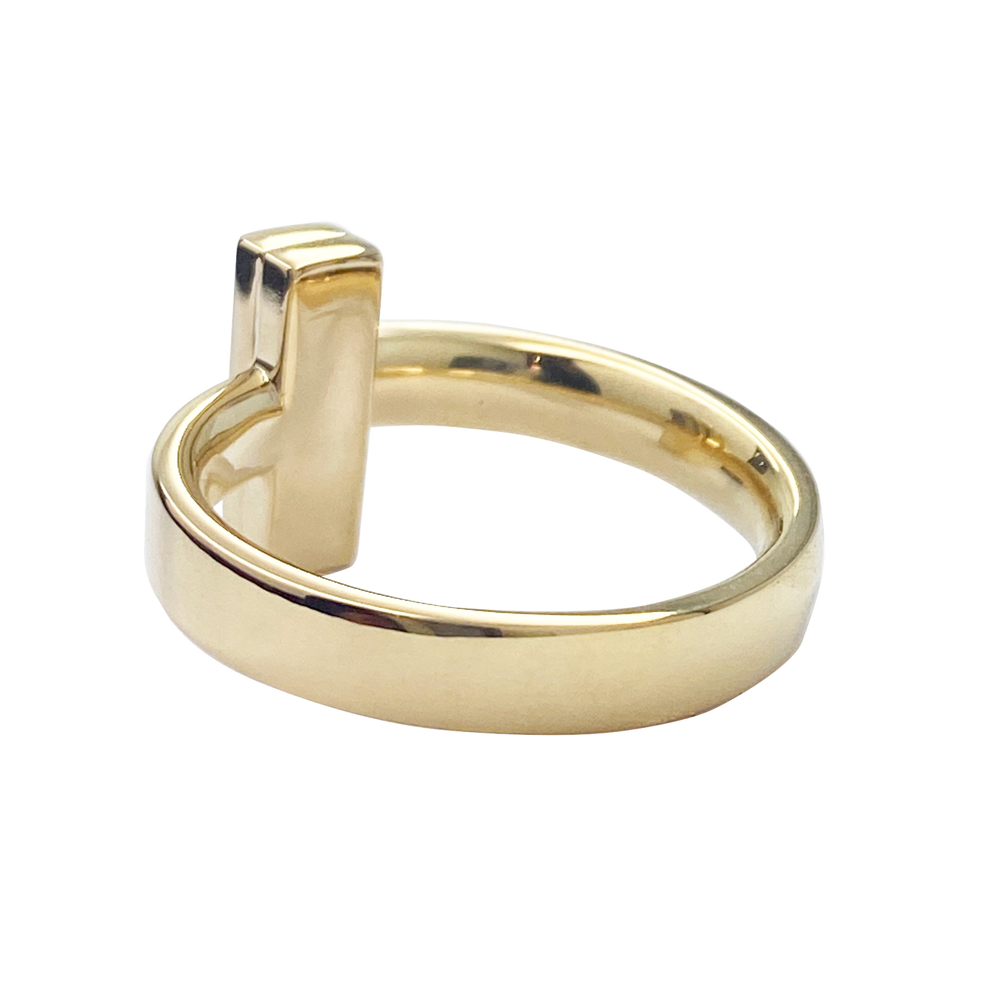 Gold ring with a unique design on a white background