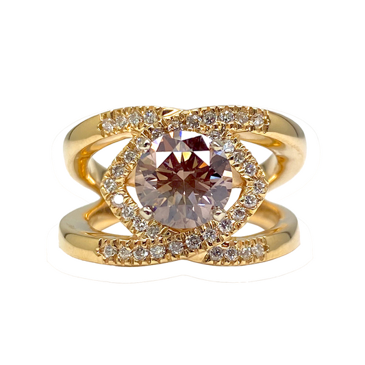 Gold ring with a large, round champagne diamond in a halo setting. 