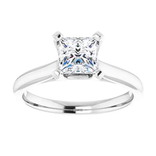 Silver ring with a square-cut diamond on a white background