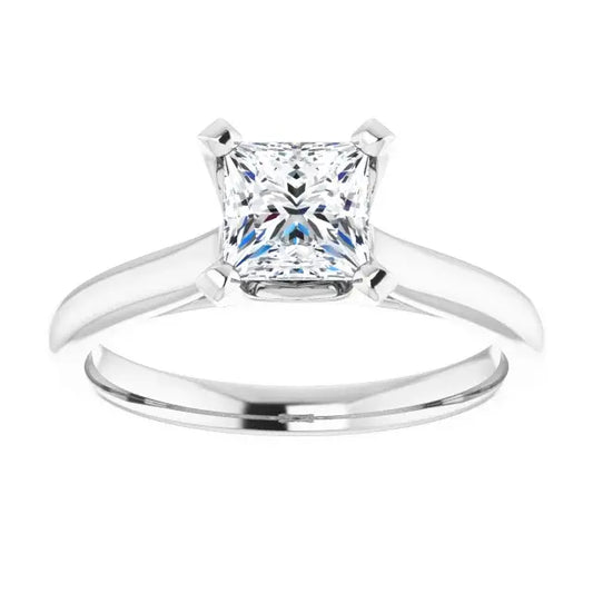 Silver ring with a square-cut diamond on a white background