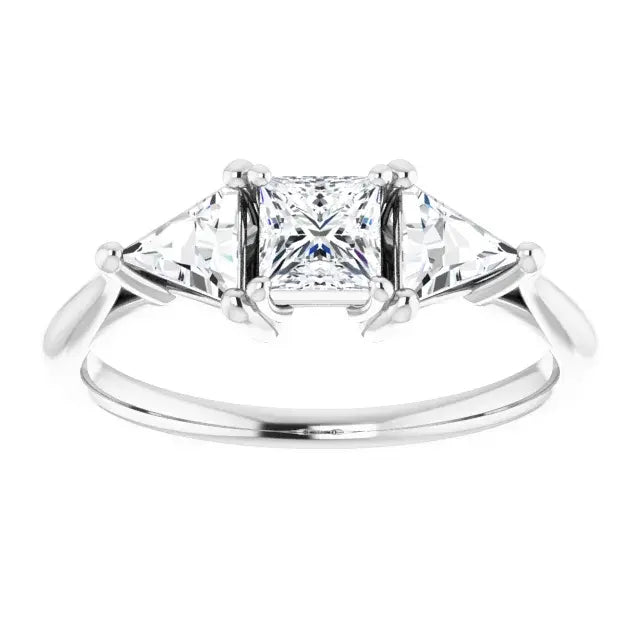 Diamond ring with a three-stone design on a white background