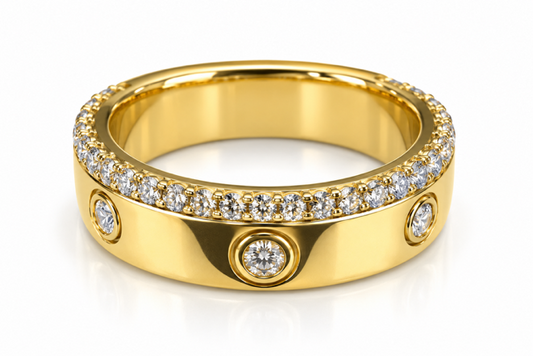 A yellow gold eternity-style ring featuring a continuous row of small clear round diamonds along the top band, with three larger round diamonds set in bezel settings on the front. The ring is photographed on a clean white background with a soft reflection.