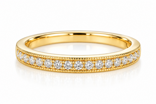 A 14K yellow gold band with a row of natural round diamonds framed by milgrain edges, on a white background.