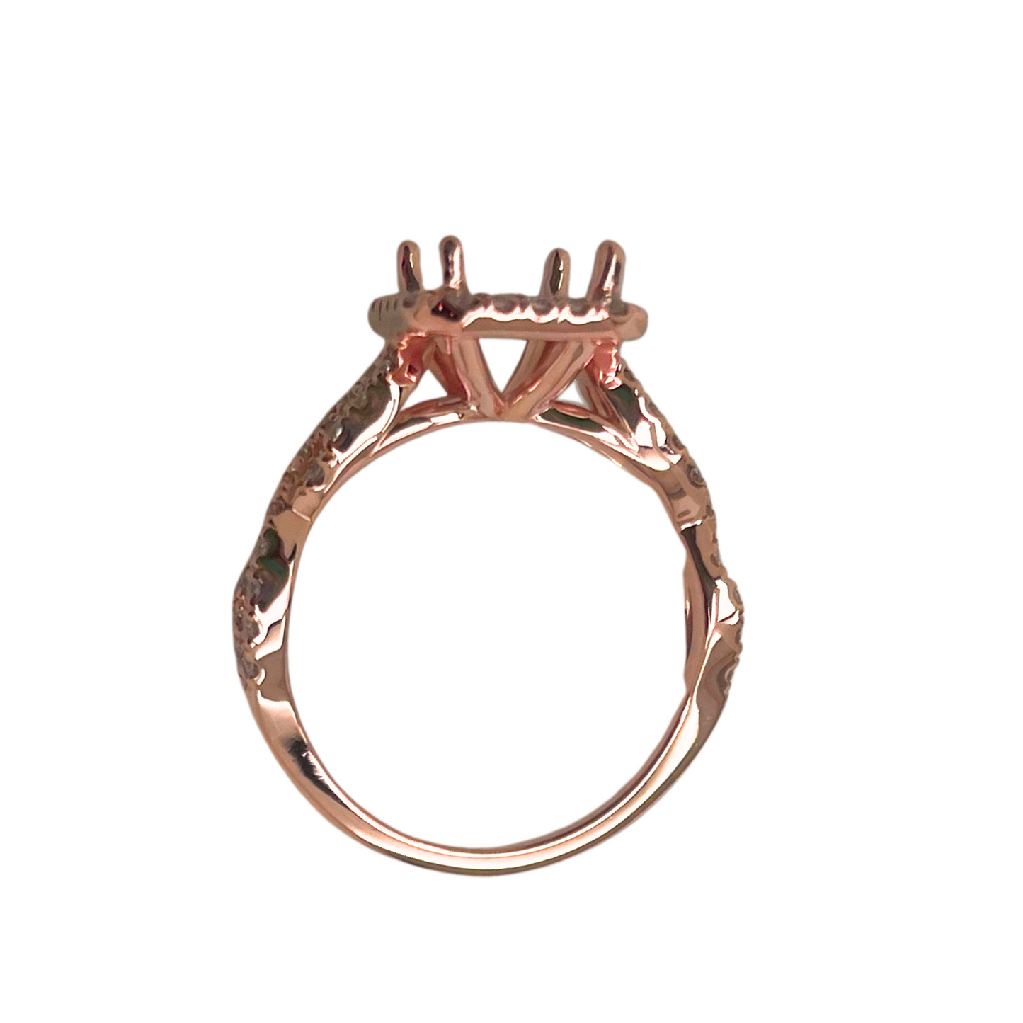 Rose gold ring with a unique design on a white background