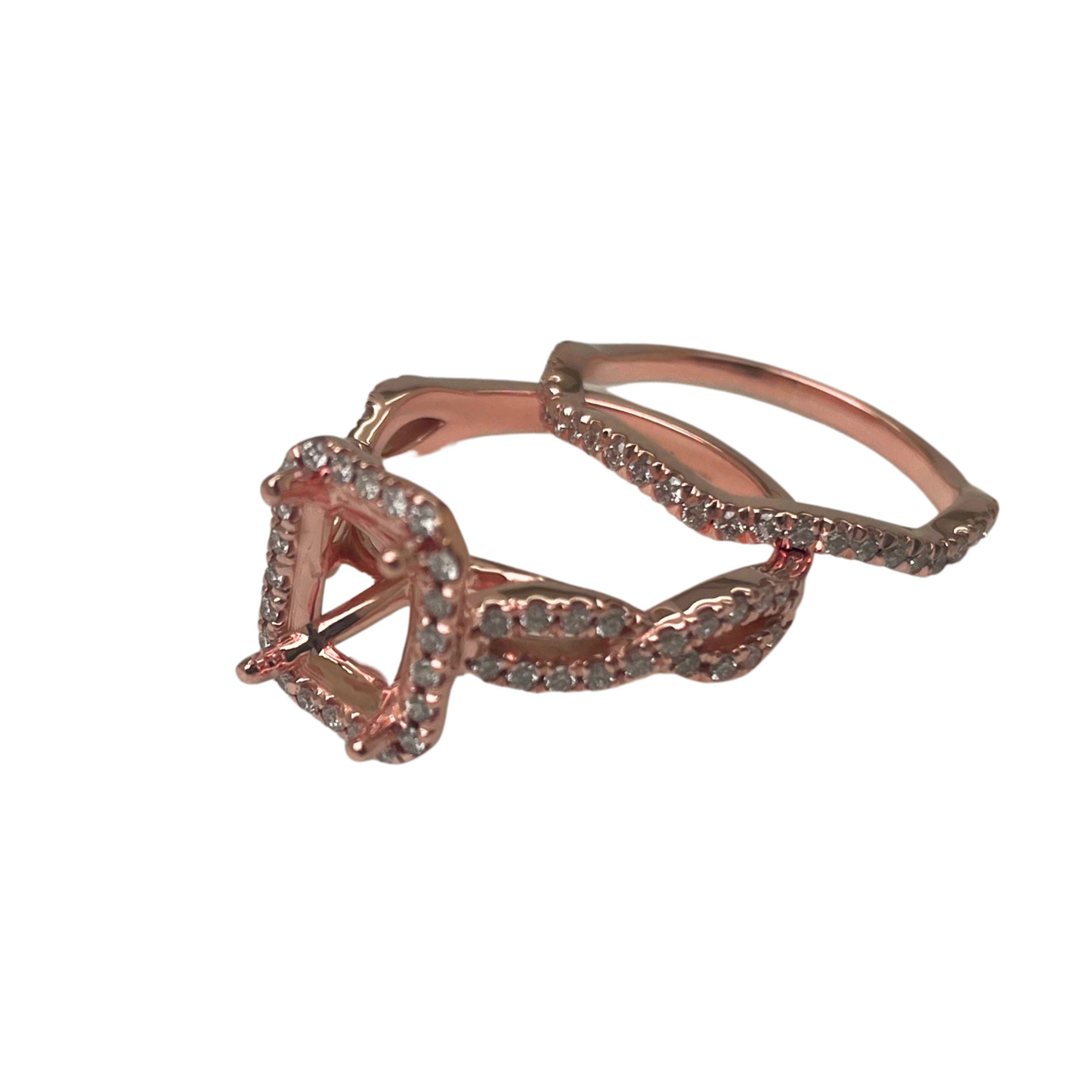 Rose gold ring with diamond accents on a white background