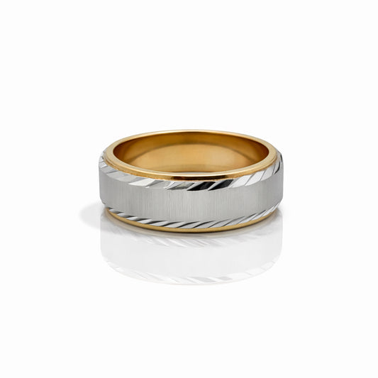 Two-tone ring with gold and silver bands on a white background