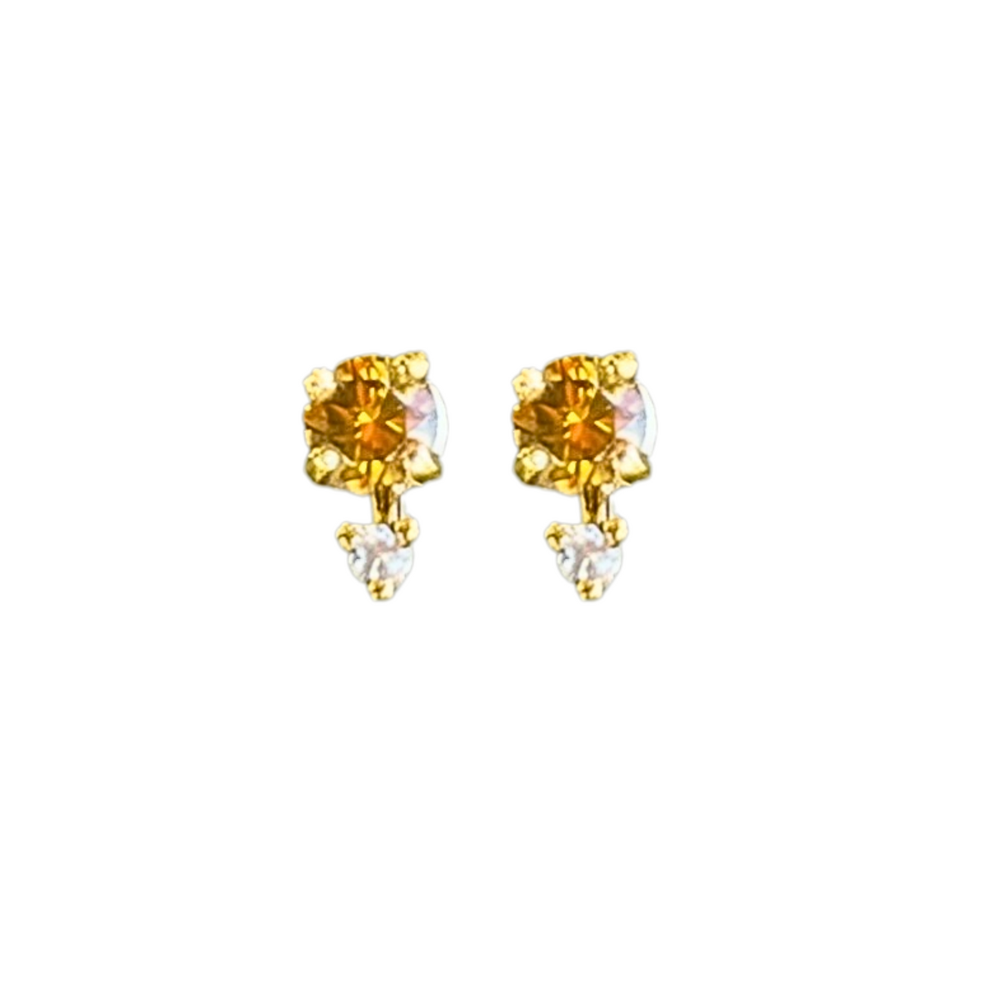 Gold earrings with yellow gemstones on a white background