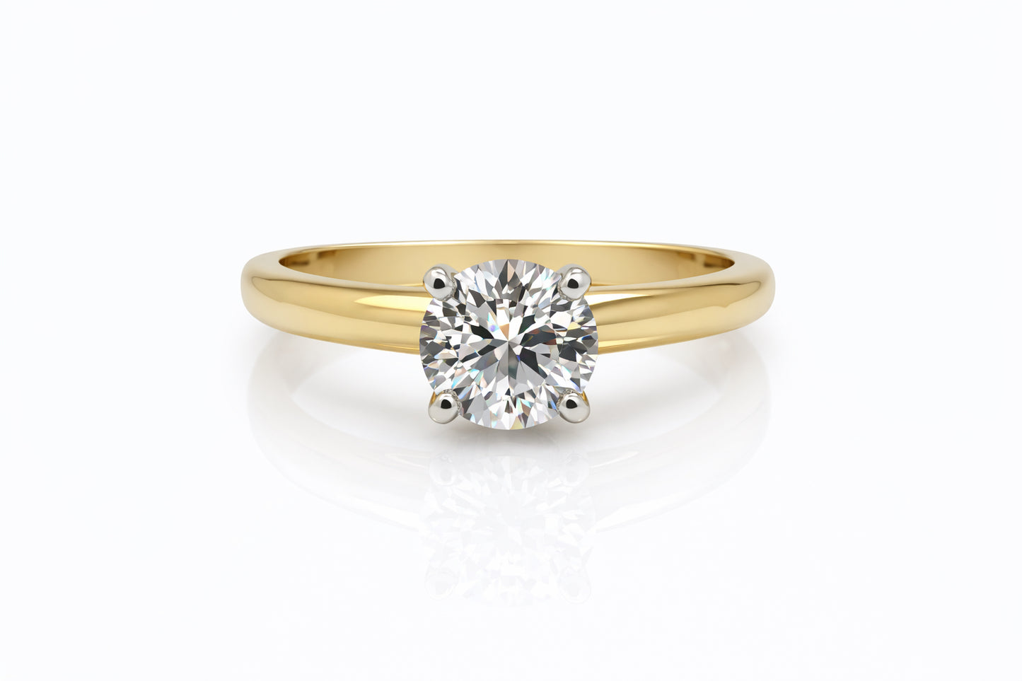 Gold ring with a diamond on a white background