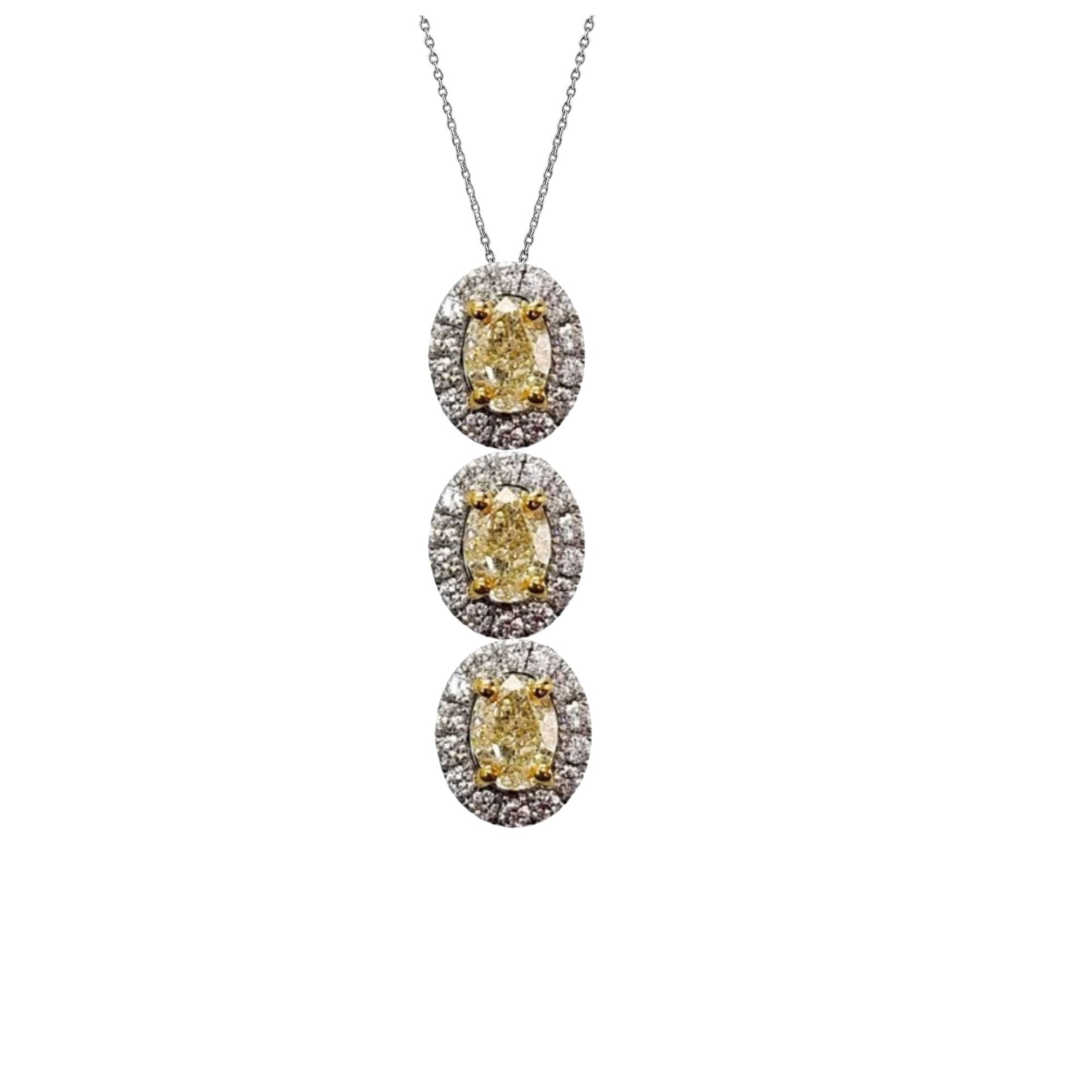 Three-tiered diamond necklace with yellow gemstones on a white background