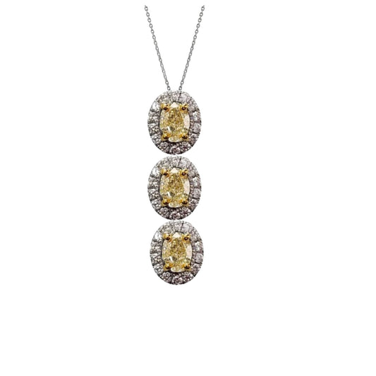Three-tiered diamond necklace with yellow gemstones on a white background