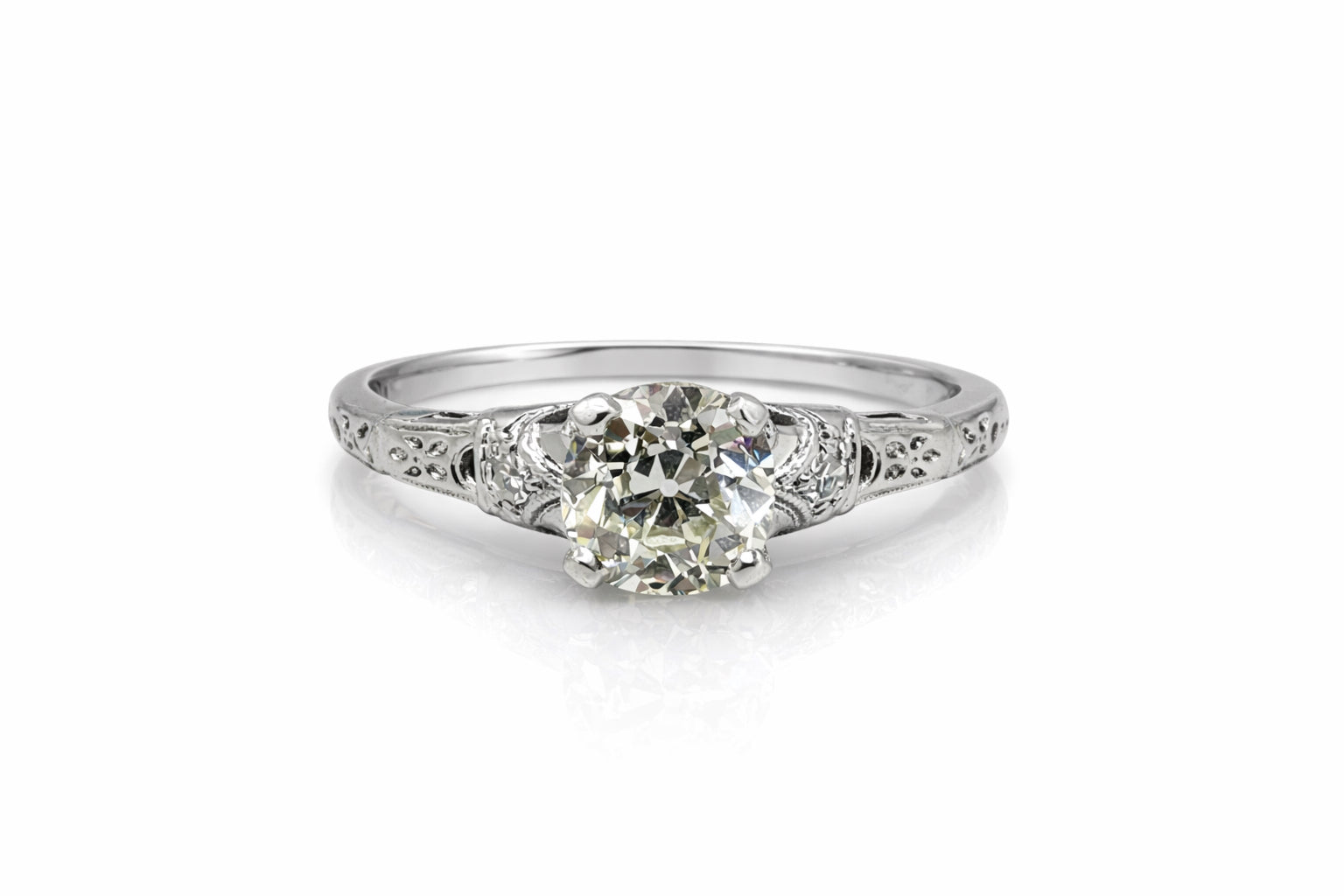 Diamond ring with intricate design on a white background