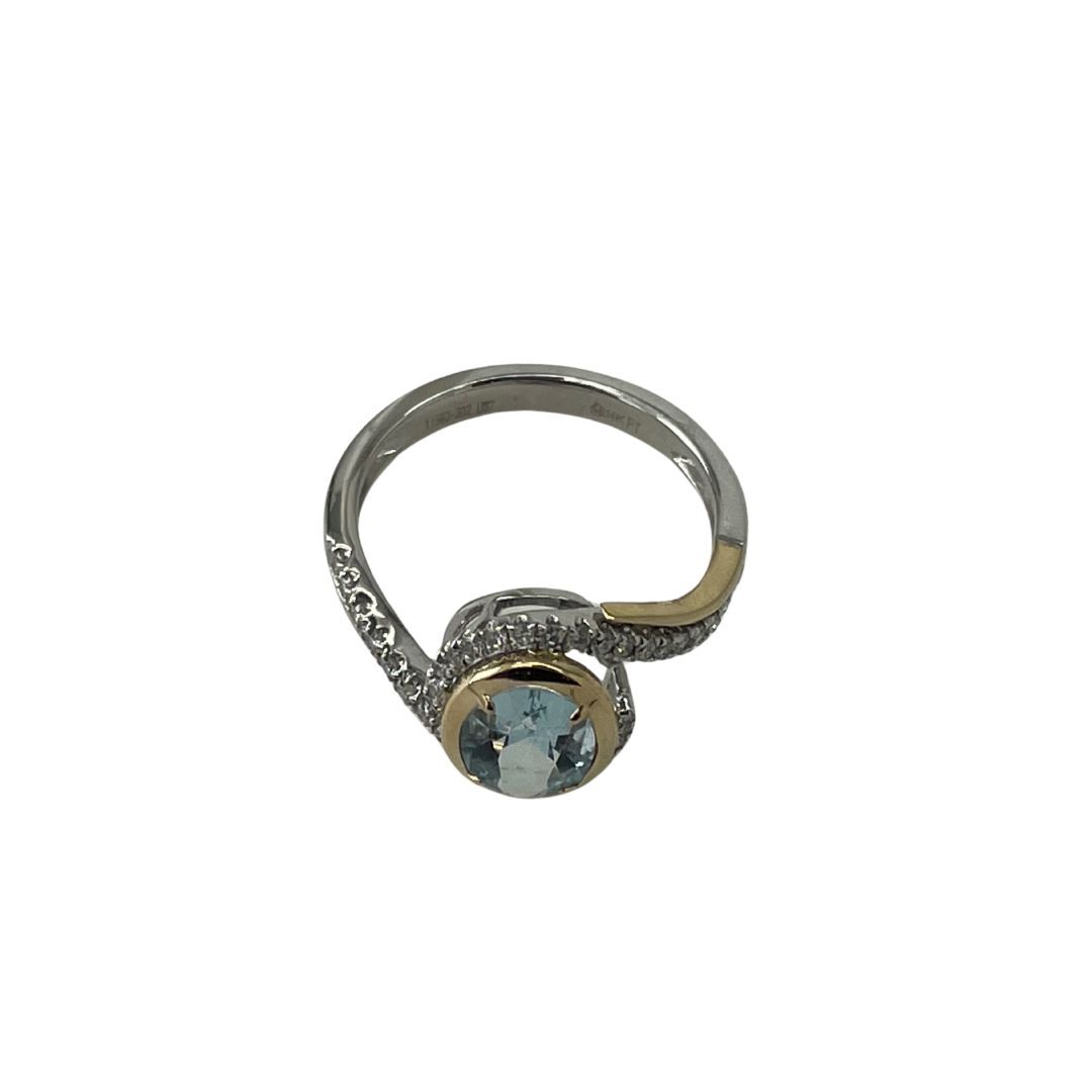 Silver ring with a blue gemstone on a white background