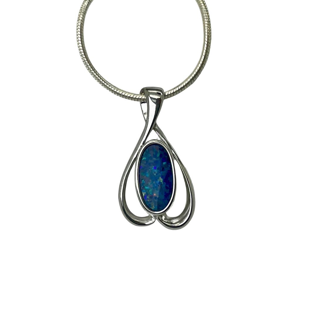 Silver pendant with a blue stone on a white background