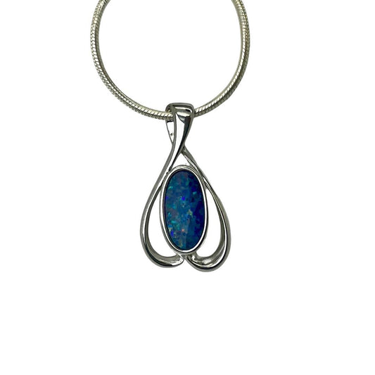 Silver pendant with a blue stone on a white background