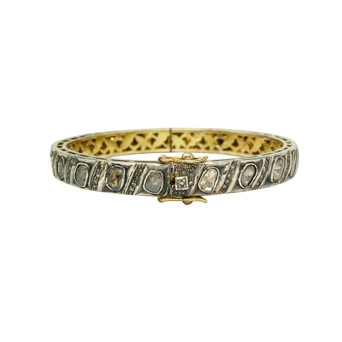 Gold bracelet with embedded stones on a white background