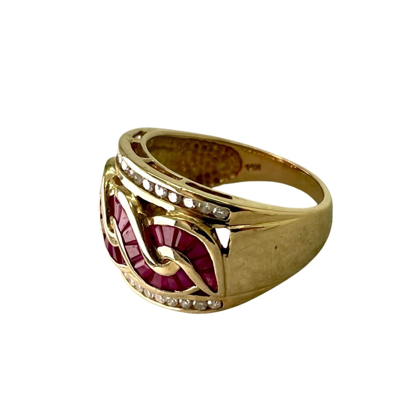 Gold ring with red gemstone and diamond accents on a white background