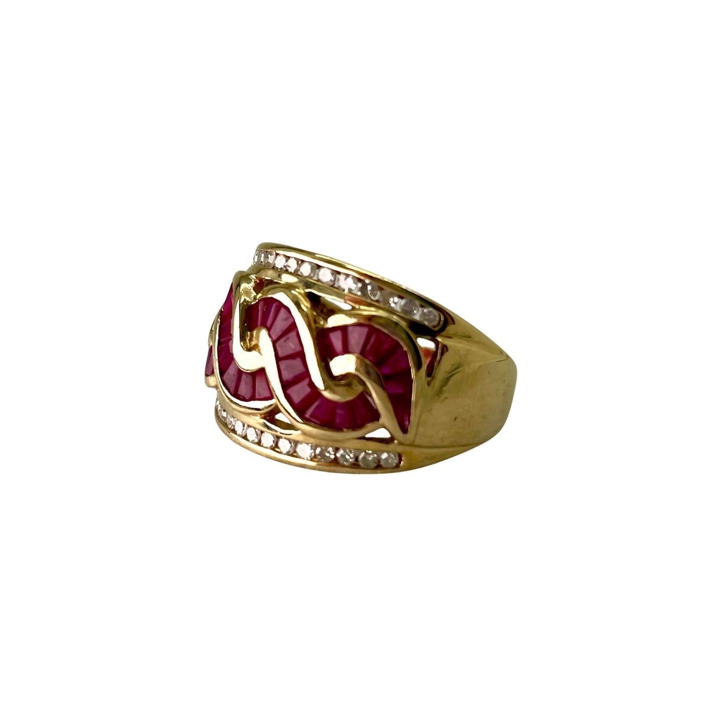 Gold ring with red gemstones and diamonds on a white background