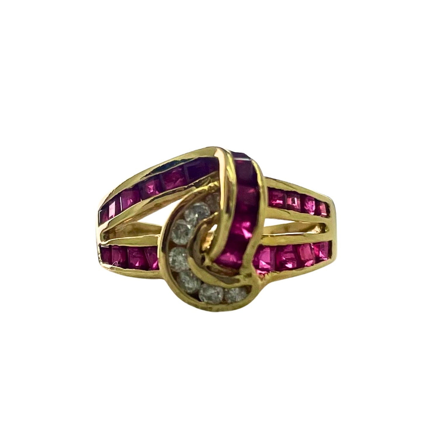 Gold ring with red gemstones and small diamonds on a white background