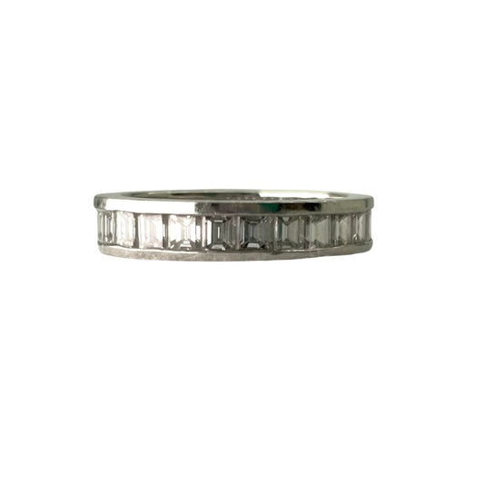 Silver ring with baguette-cut gemstones on a white background