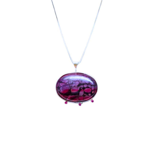 Necklace with a purple pendant on a white background