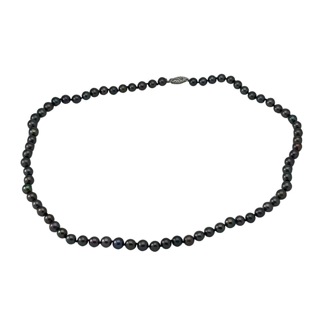 Black beaded necklace on a white background