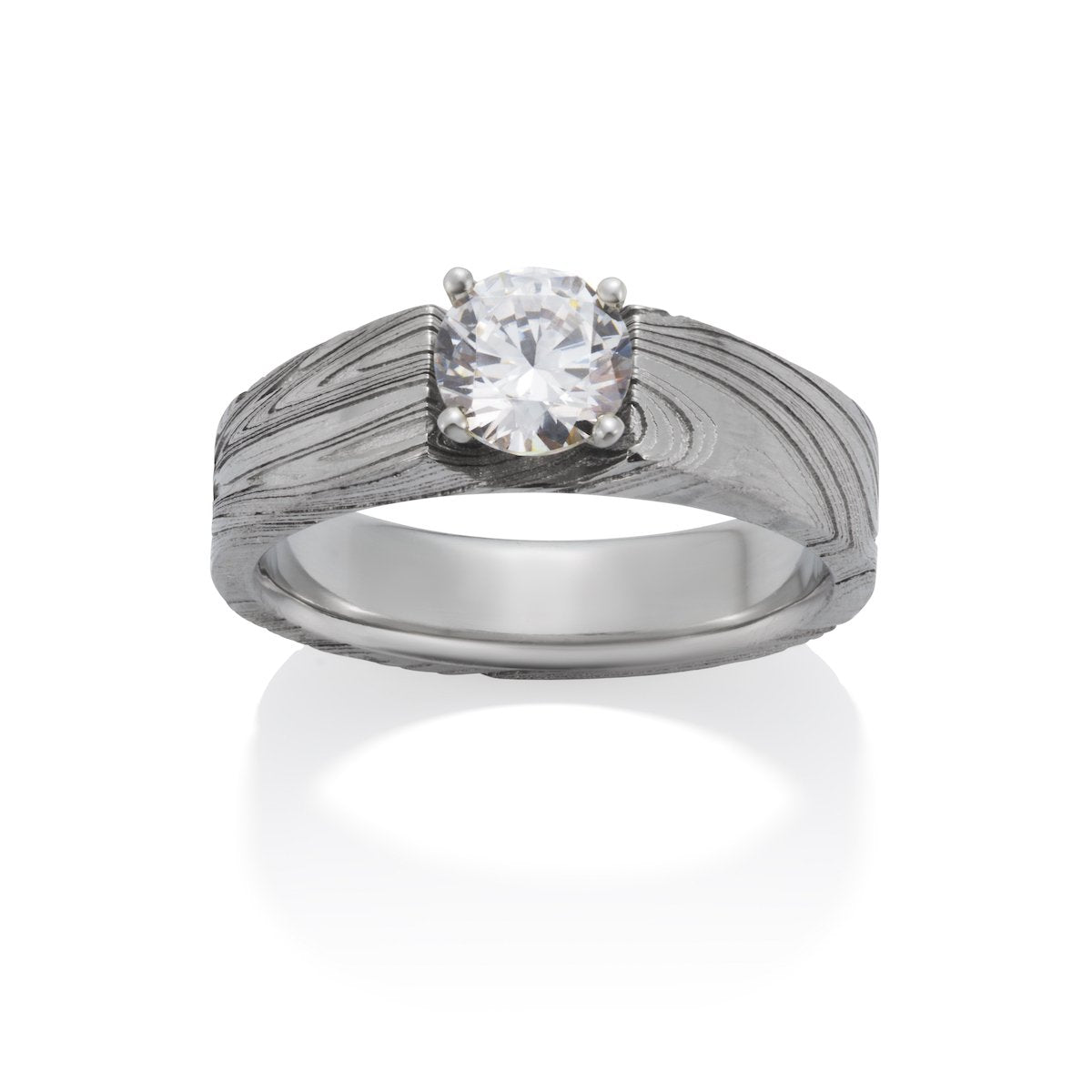 Silver ring with a round diamond and a Damascus steel band on a white background