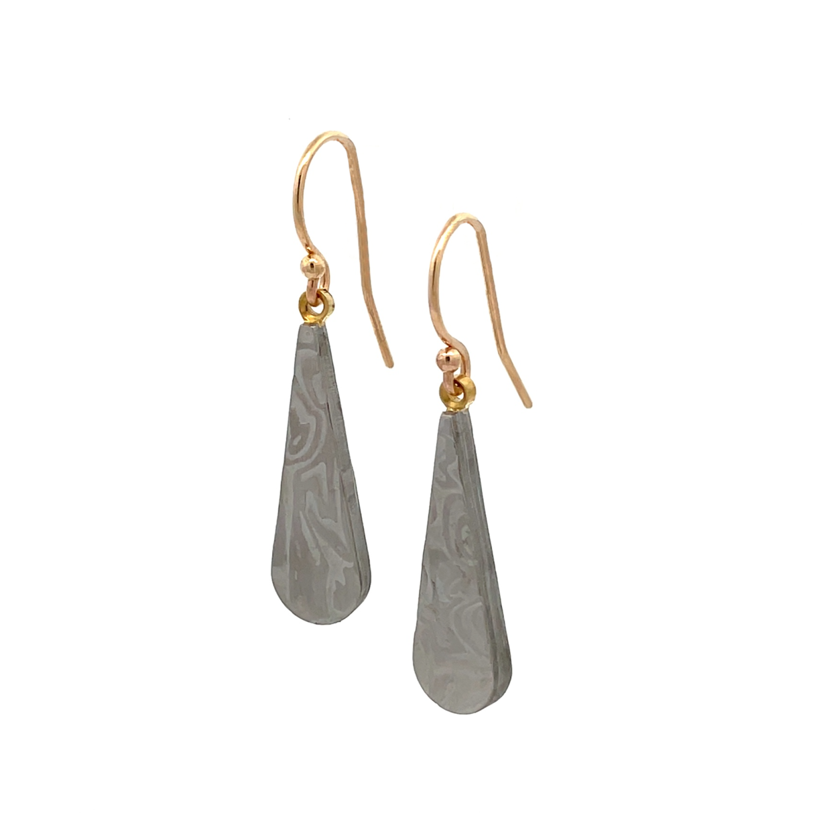 Pair of gold hoop earrings with a damascus steel pattern, on a white background.