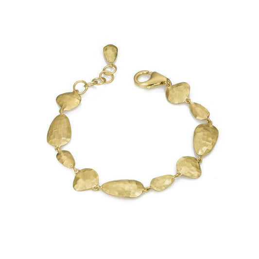 Gold bracelet with leaf-shaped links on a white background