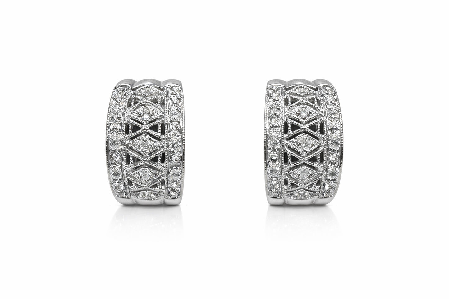 Pair of diamond earrings on a white background