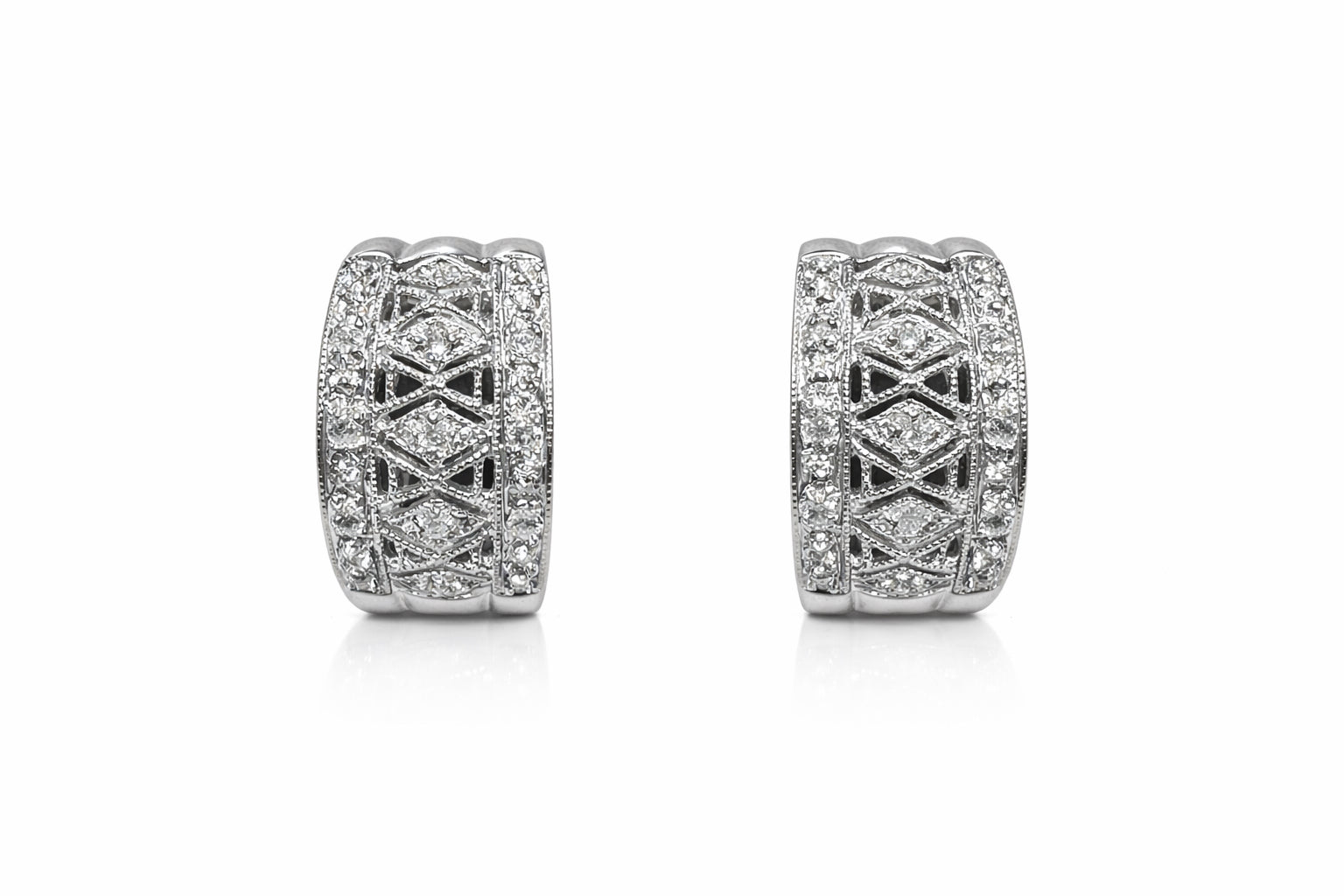 Pair of diamond earrings on a white background