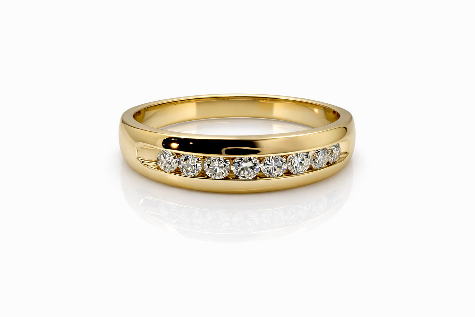 Gold ring with embedded diamonds on a white background