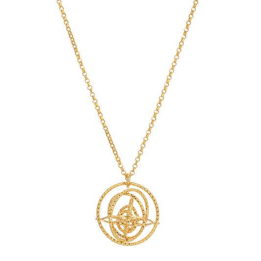 Gold necklace with a intricate circular pendant on a white background