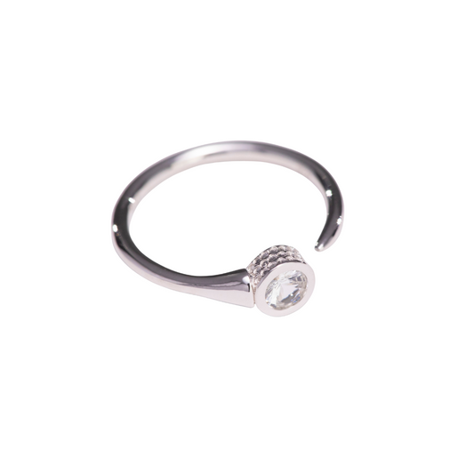 Silver golf T ring with a central diamond on a white background